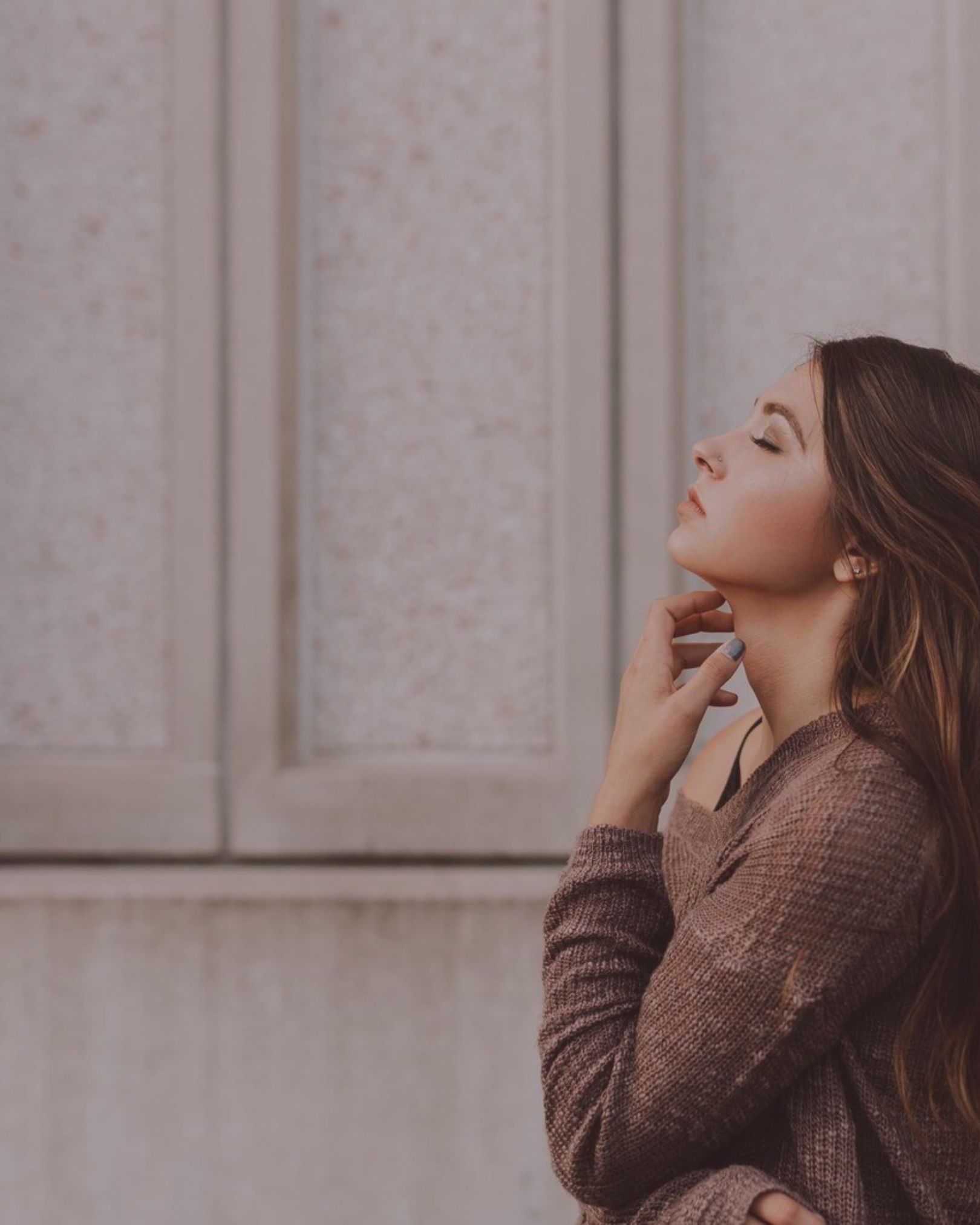 Sad woman lifting her face to heaven